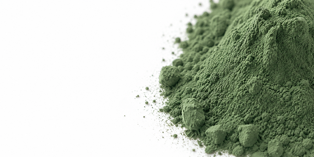 Green powder on a white background